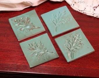 Handmade Ceramic Teal Drink Coasters with Leaf Stamp Pattern | Set of 4