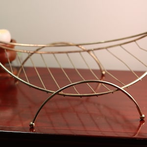 Vintage 1950&#39;s Atomic Mid Century Modern Gold Curved Wire Firewood Rack w/ Handle | Towel or Magazine Holder