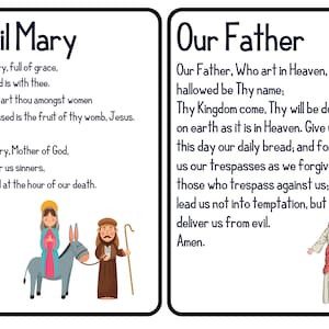 Peut inclure: Deux cartes illustr&eacute;es avec des textes religieux. La carte de gauche affiche "Je vous salue Marie" avec la pri&egrave;re et une illustration de Marie, d'un &acirc;ne et d'un homme. La carte de droite affiche "Notre P&egrave;re" avec la pri&egrave;re et une illustration de J&eacute;sus.