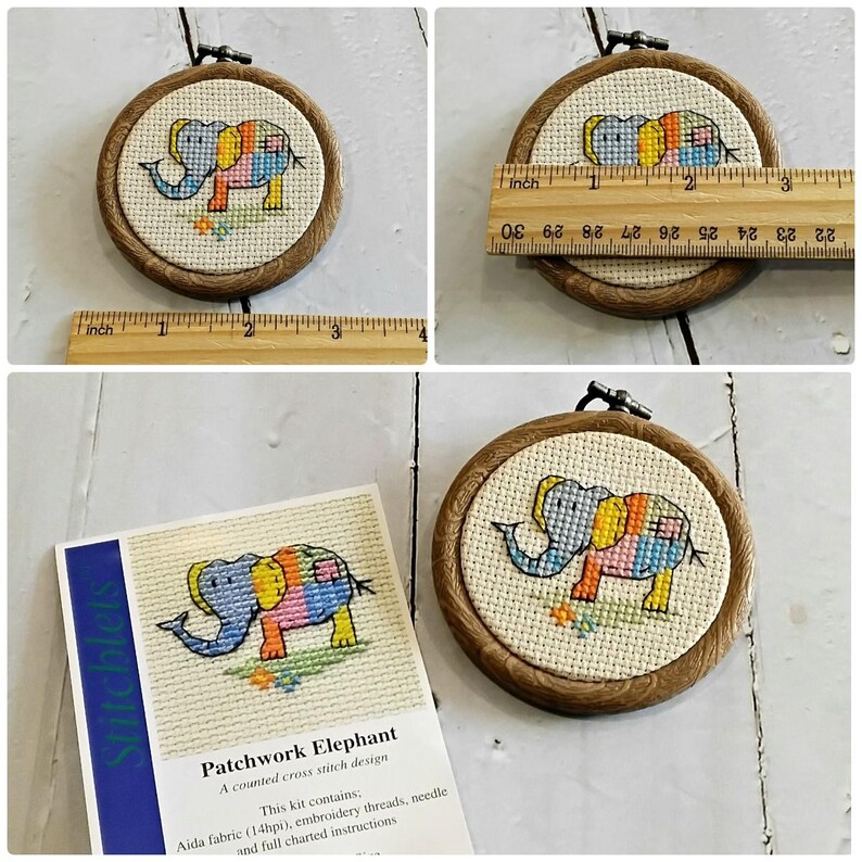 May include: A cross-stitch embroidery hoop with a patchwork elephant design. The wooden hoop is about 7.6 cm in diameter. The kit includes Aida fabric, embroidery threads, a needle, and instructions. The text reads "Patchwork Elephant".