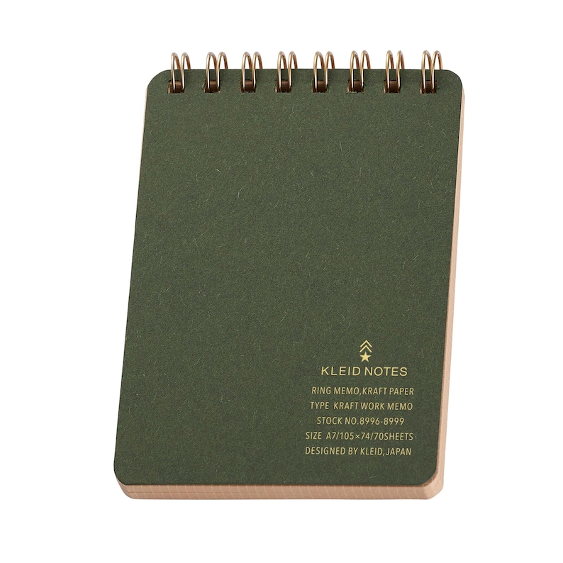 May include: A small, olive green Kleid Notes ring memo notebook. The notebook has a gold spiral binding and a kraft paper cover. Text on the cover includes "KLEID NOTES" and other details. The notebook measures approximately 4.1 x 2.9 inches.