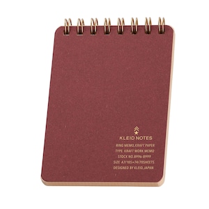 May include: A burgundy A7 ring memo notepad with gold spiral binding. The notepad features the text "KLEID NOTES" and other details about the product. The notepad is made of kraft paper and has 70 sheets.
