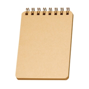 May include: A small, tan spiral-bound notepad with a grid pattern on the pages. The spiral binding is made of gold-colored metal. The notepad is rectangular with rounded corners and is set against a white background.