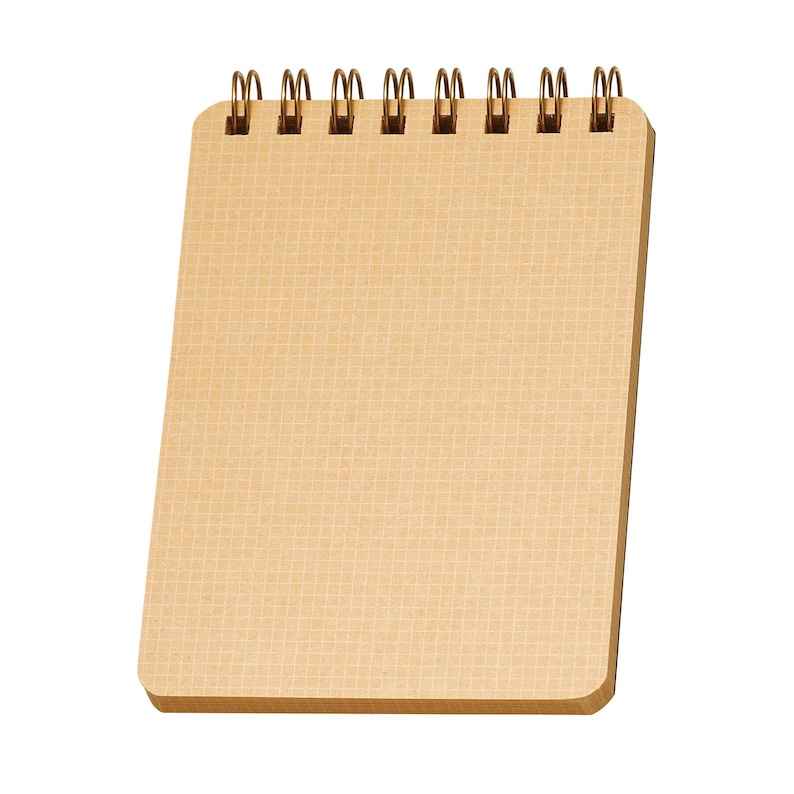 May include: A small, tan spiral-bound notepad with a grid pattern on the pages. The spiral binding is made of gold-colored metal. The notepad is rectangular with rounded corners and is set against a white background.
