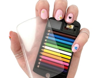 May include: A small, black pencil case with a clear plastic cover, holding a set of colorful pencils. The case also includes a pencil sharpener. The pencils are arranged in a neat row, showcasing a spectrum of colors.