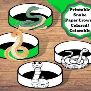 Op de afbeelding: Printbare slangen papieren kronen in drie ontwerpen: een groene slang, een gele slang en een zwart-witte slang. De kronen zijn klaar om in te kleuren.