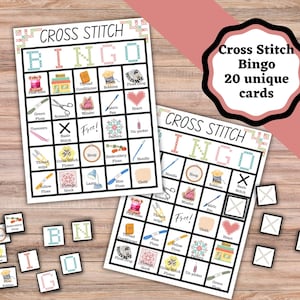 May include: Cross stitch bingo game set with 20 unique cards. The bingo cards feature cross-stitch-related images and words. Includes individual bingo tiles with letters and cross-stitch images. The game is set on a wooden background.