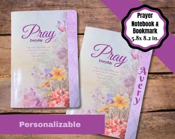 May include: Two prayer notebooks with floral covers featuring yellow, pink, and purple flowers, a butterfly, and the text "Pray Everyday". One notebook includes the name "Avery" on a purple side panel. The dimensions are 5.8x8.2 inches.