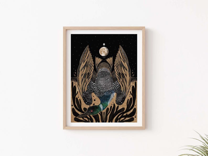 May include: A framed art print featuring a stylized loon with wings spread wide against a black starry sky. The bird has a speckled body, a green neck, and a long beak. Above the loon is a full moon, and below are dark, abstract plant-like shapes.