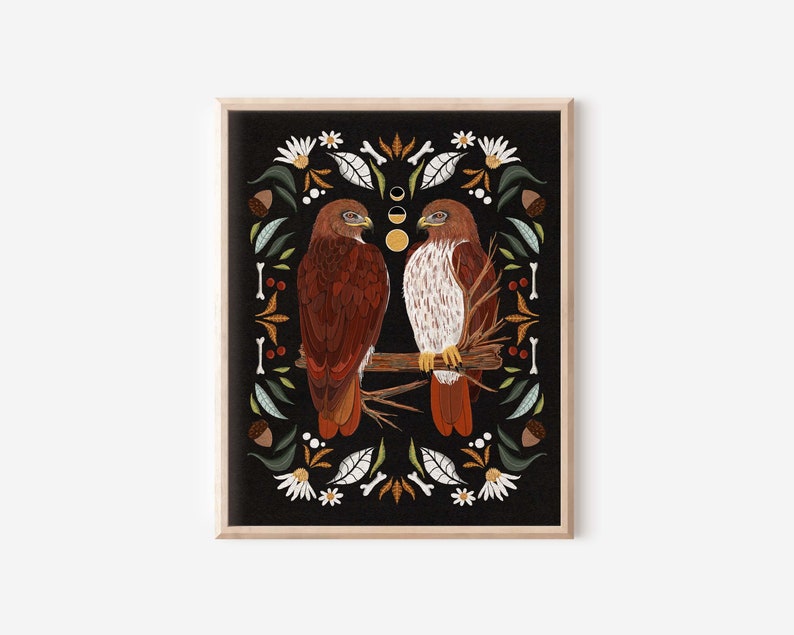 May include: Two red-tailed hawks perched on a branch, surrounded by a border of leaves, flowers, and other natural elements on a black background.