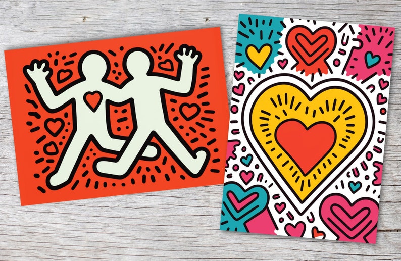 Puede incluir: Dos impresiones art&iacute;sticas de estilo pop art. Una es naranja con dos figuras tomadas de la mano, cada una con un coraz&oacute;n. La otra es blanca con un gran coraz&oacute;n amarillo y corazones m&aacute;s peque&ntilde;os en rosa, azul y amarillo.
