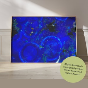 May include: Abstract digital art print featuring a close-up of a blue and gold mineral with a swirling pattern. The print is framed in a gold frame and is ready to be downloaded.