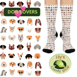 May include: White knee-high socks with a pattern of various dog breeds. The socks have black heels and toes. The image also features a green sign that says "Dog Lovers" and a round logo with a frog.