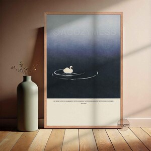 Marcus Aurelius inspirational quote wall art displayed in an oakwood  frame, featuring tranquil blue artwork.