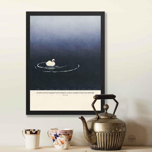Marcus Aurelius inspirational quote wall art displayed in a black frame, featuring tranquil blue artwork.