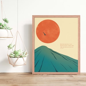 May include: A minimalist art print featuring a green mountain with a large orange sun in the background. A small black bird flies across the sky. The print includes a quote: "Whatever is beautiful at all is beautiful in itself. It's beauty ends there, and praise has no part in it." -  Ralph Waldo Emerson