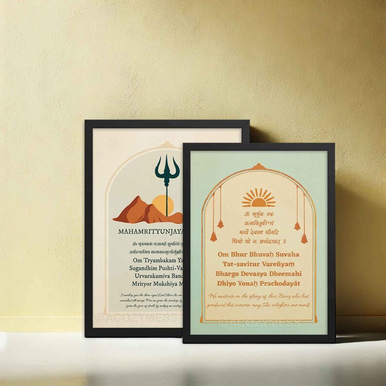 gayatri mantra and mahamrityunjaya mantra prints in black frames.