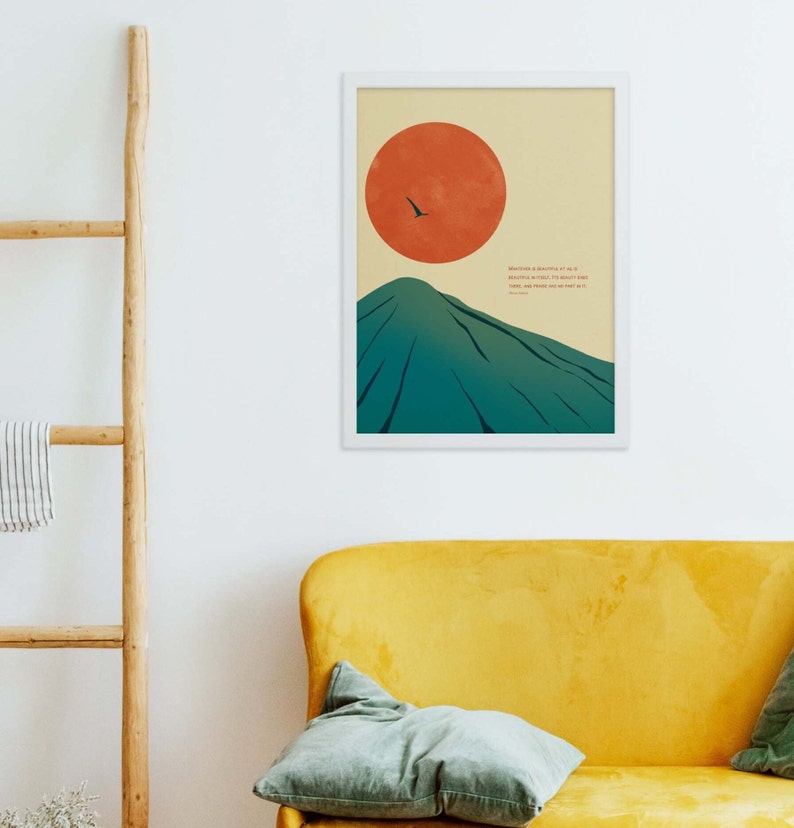 May include: A minimalist poster with a mountain and a red sun in the background. The quote "Wherever life plants you, bloom with grace" is printed in black text.