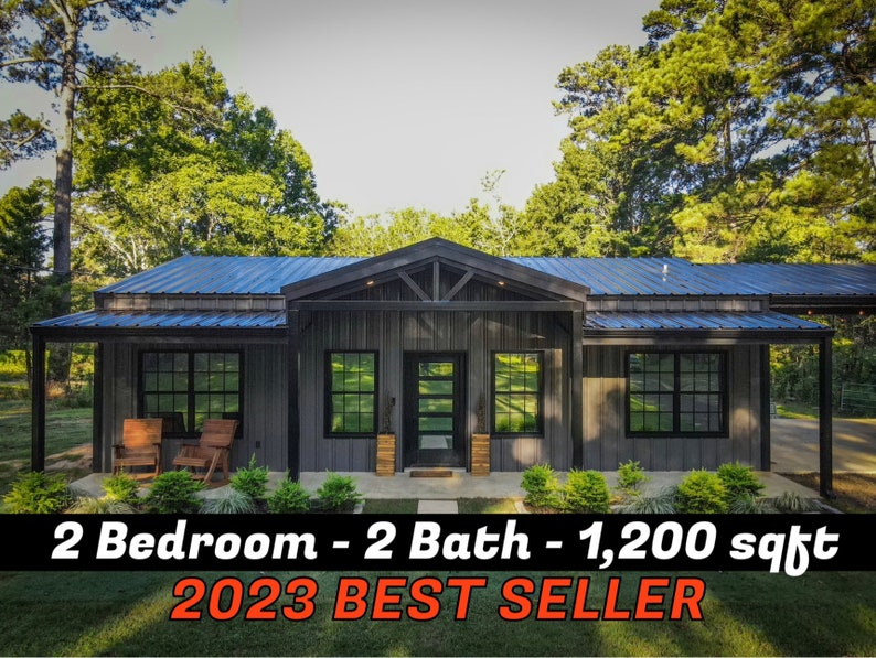 May include: A modern, grey metal-sided house with a black roof and black trim. The house has a covered porch with two rocking chairs. The house has a large front window and a black front door. The text "2 Bedroom - 2 Bath - 1,200 sq ft 2023 BEST SELLER" is displayed in red at the bottom of the image.