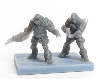 May include: Two gray 3D printed miniature figures of fantasy creatures. One figure is a humanoid with a large head and a furry body, holding a weapon. The other figure is a reptilian humanoid with a large head and a weapon.