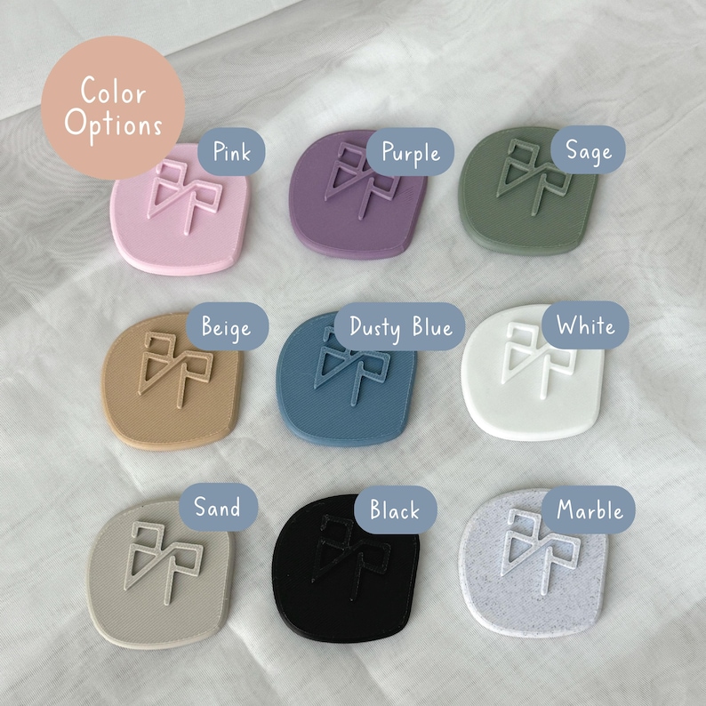 May include: A collection of nine square-shaped wax seals in various colors, including pink, purple, sage, beige, dusty blue, white, sand, black, and marble. Each seal features a stylized bow design. The words "Color Options" are in a circle at the top.