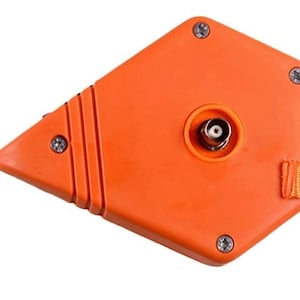 May include: An orange, diamond-shaped device with a central connector and a fabric strap. The device has four screws and a flexible orange plastic loop. The strap is orange and attached with a screw.