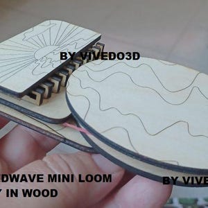 May include: A wooden Speedwave Mini Loom, made of natural wood with a sun and wave design. The loom is made by Vived03D and is only available in wood. The text "Speedwave Mini Loom" and "Only in Wood" is printed on the loom.