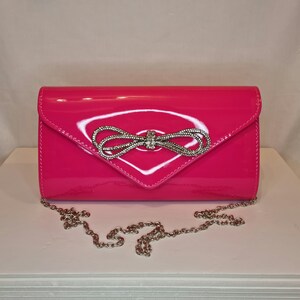 Neon pink patent clutch bag shop