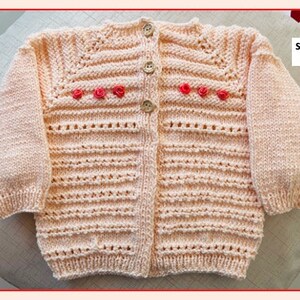 Pink hand-knitted baby girl&#39;s sweater for a 3-6 month old