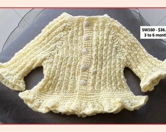 White hand-knitted "ruffly" sweater for a 3-6 month old