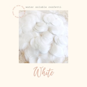 May include: White water soluble confetti. The confetti is in the shape of circles and is piled high.