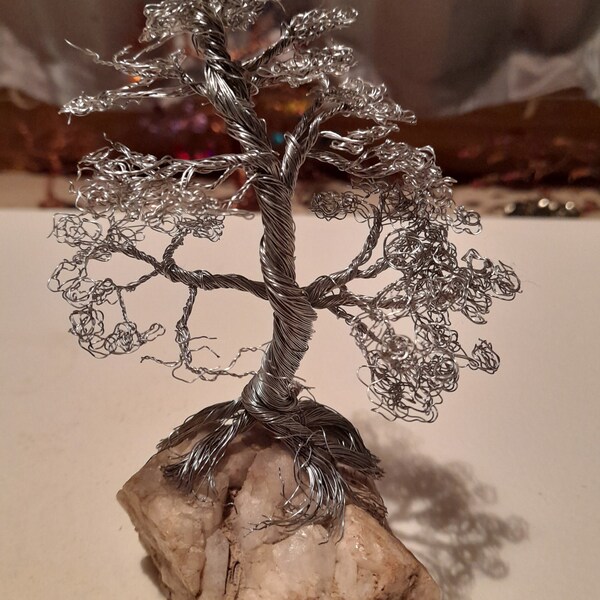 silver bonsia wire sculpture on a cluster  of crystals  from w.a yallingup