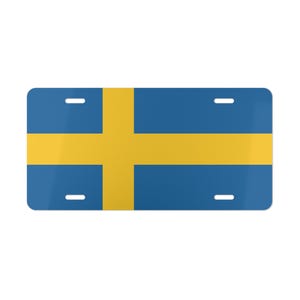 May include: A blue and yellow license plate featuring the flag of Sweden.