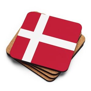 May include: Set of four square cork coasters featuring the Danish flag. The flag is red with a white cross.