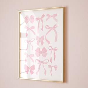 Pink bow wall art with soft watercolor ribbon artwork for coquette room decor.