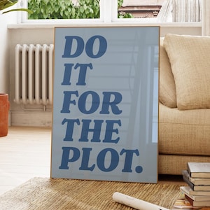 May include: A blue and white framed poster with the text "DO IT FOR THE PLOT." in a bold, blue font.