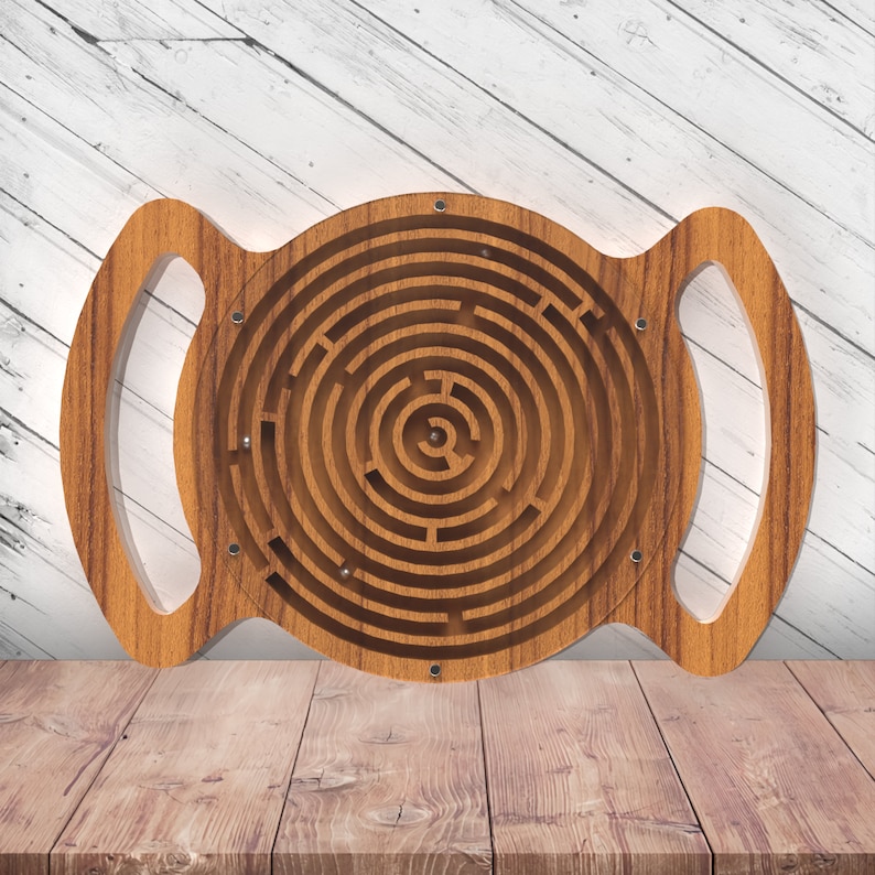 May include: Wooden circular maze with a handle on each side. The maze is made of light brown wood and has a complex pattern of paths.