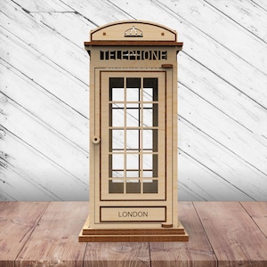 May include: A wooden model of a classic red British telephone box. The box is detailed with a crown on top, the word "TELEPHONE" on the front, and the word "LONDON" on the bottom.
