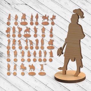 May include: A set of 36 wooden cutout figures of knights, archers, and other medieval characters. The figures are arranged in rows on a wooden surface. A larger wooden cutout of a knight with an axe is standing on a separate wooden base.