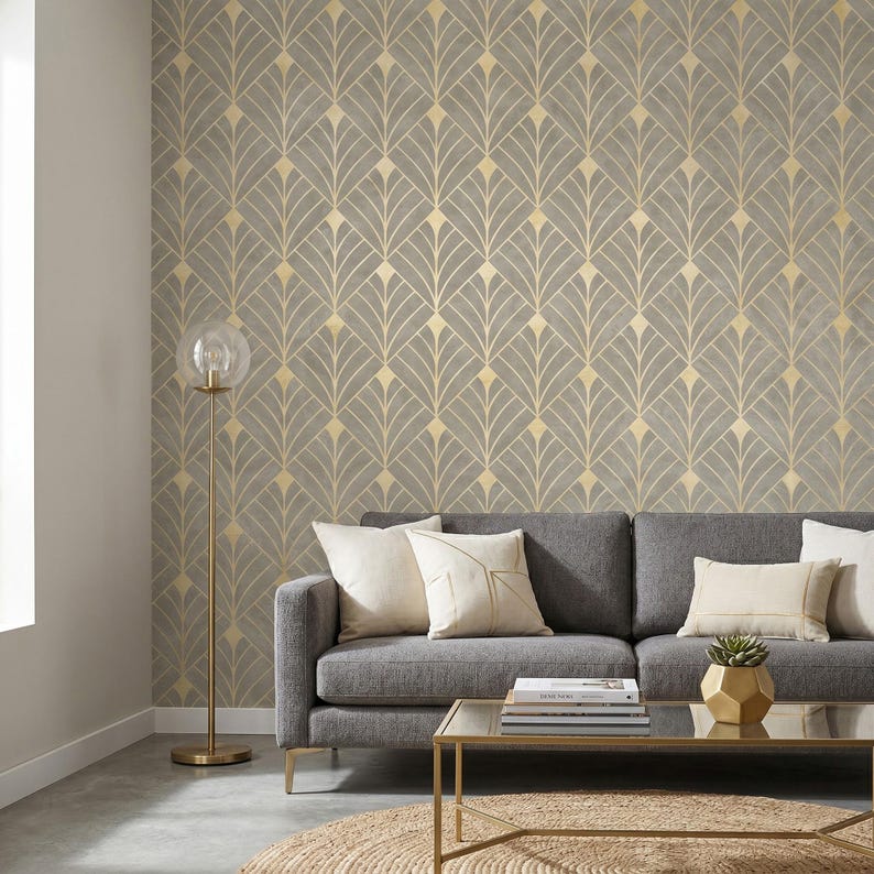 May include: Wallpaper featuring a repeating fan-shaped geometric pattern in muted gray and metallic gold lines. The design consists of symmetrical, upward-pointing arches arranged in a grid, creating a structured, decorative wall covering.