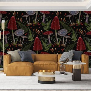 May include: A living room interior with a brown leather sectional sofa and two side tables. The wall behind the sofa is covered with a black and red wallpaper featuring a repeating pattern of mushrooms and ferns.