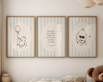 May include: Three framed prints with a blue and white striped background. The prints feature Winnie the Pooh illustrations and a quote from the book Winnie the Pooh by A.A. Milne: "Sometimes the smallest things take up the most room in your heart."