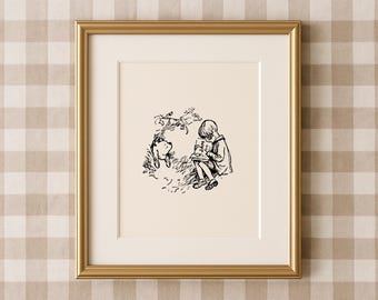 May include: A framed black and white illustration of a child reading a book with the word "JAM" on the cover, and a bear-like character. The artwork is set against a cream background, framed in gold. The frame is a classic design.