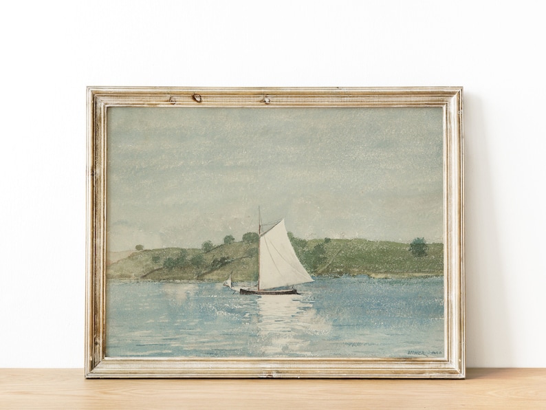May include: A framed watercolor painting of a sailboat on a body of water with a green grassy hill in the background.