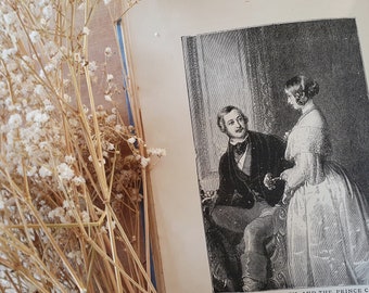 May include: A black and white engraving of Queen Victoria and Prince Albert. The engraving is from a painting by Sir Edwin Landseer and is titled "Her Majesty the Queen, and the Prince Consort".