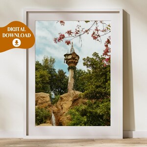 May include: A tall, stone tower with a pointed roof and windows, surrounded by lush green trees and pink flowers. The tower is nestled in a rocky cliff with a small waterfall cascading down the side.