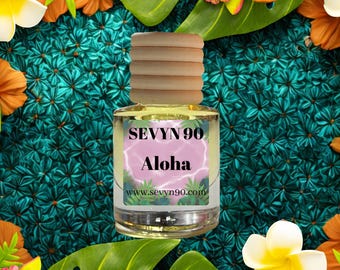 May include: A clear glass bottle with a wooden cap, filled with a yellow liquid. The label reads "SEVYN 90 Aloha" with a pink background. The bottle is surrounded by tropical flowers and leaves against a teal background.