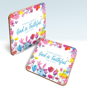 May include: Two square coasters with a floral design and the text "In every season God is Faithful Psalm 119:90". The coasters have a white background with colourful flowers in pink, red, yellow, and blue.