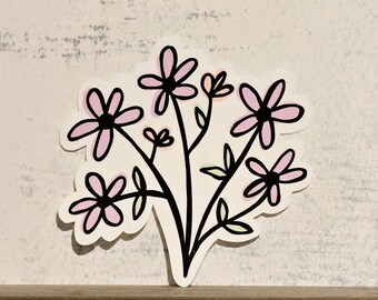May include: A sticker featuring a bouquet of pink and white flowers with black outlines. The flowers are stylized and have a simple, whimsical design.