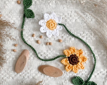 Crocheted bookmark with sunflower and leaves